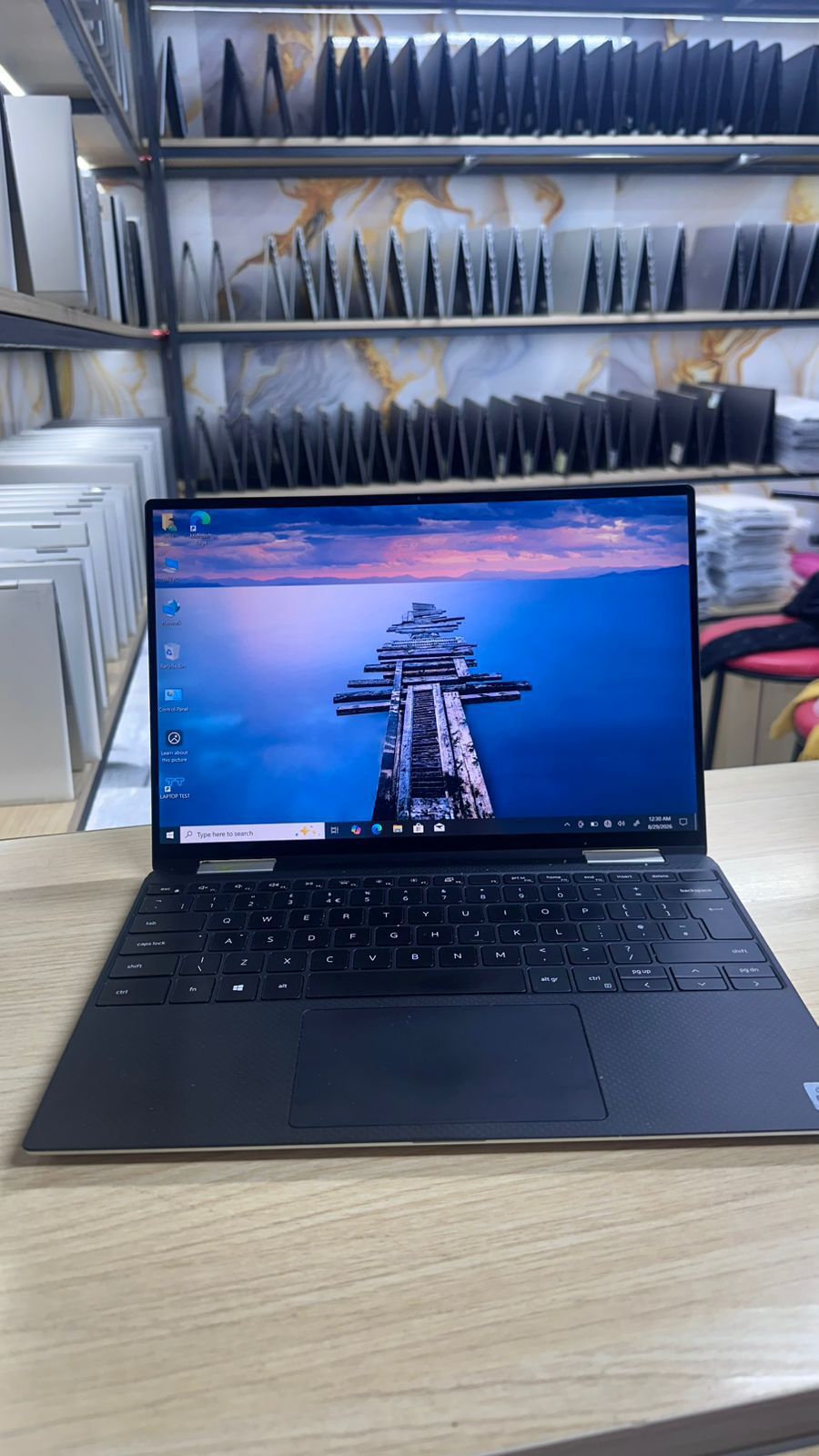 Dell XPS 13 7390 2-in-1 is a 360-degree convertible laptop featuring a 10th Generation Intel Core i7 processor, 16GB of RAM, a 512GB SSD, and a touch screen display. product photo